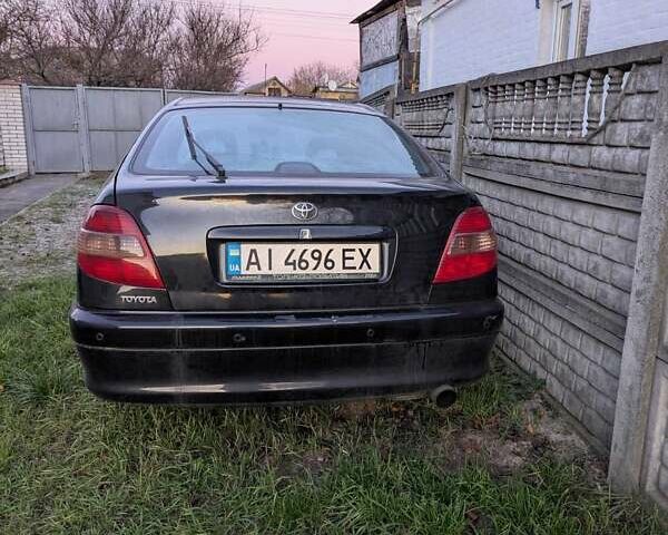 Черный Тойота Авенсис, объемом двигателя 2 л и пробегом 300 тыс. км за 3500 $, фото 1 на Automoto.ua