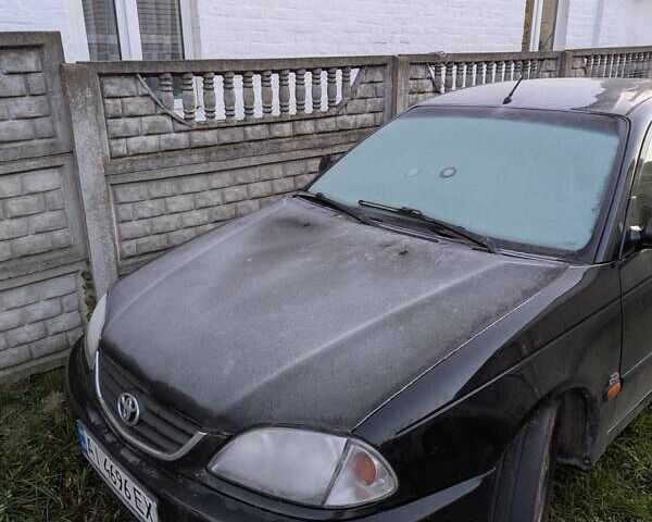 Черный Тойота Авенсис, объемом двигателя 2 л и пробегом 300 тыс. км за 3500 $, фото 2 на Automoto.ua