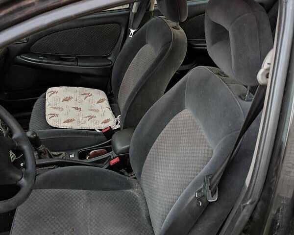 Черный Тойота Авенсис, объемом двигателя 2 л и пробегом 300 тыс. км за 3500 $, фото 6 на Automoto.ua