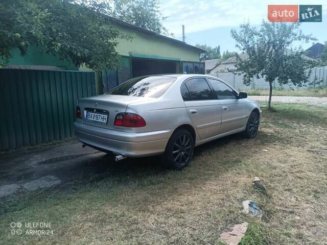 Серый Тойота Авенсис, объемом двигателя 1.76 л и пробегом 450 тыс. км за 3800 $, фото 2 на Automoto.ua