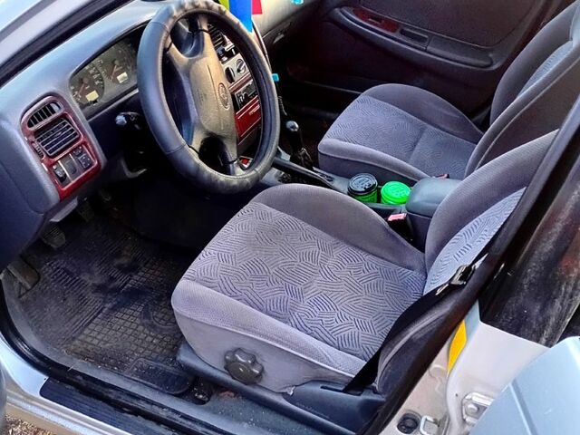 Серый Тойота Авенсис, объемом двигателя 1.8 л и пробегом 425 тыс. км за 3500 $, фото 1 на Automoto.ua