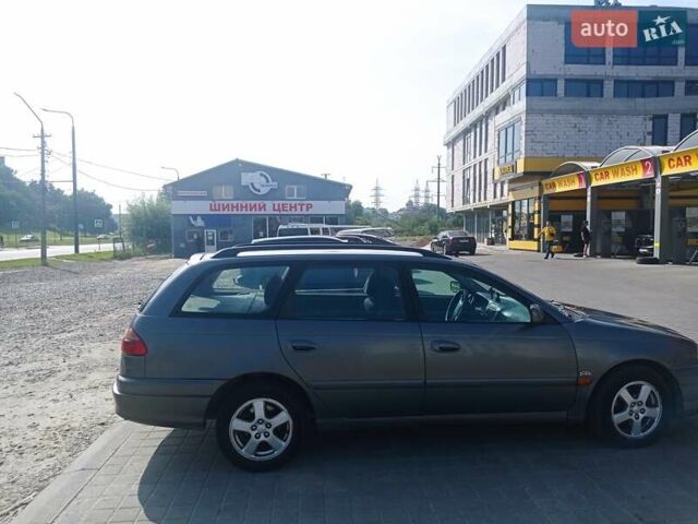 Серый Тойота Авенсис, объемом двигателя 2 л и пробегом 350 тыс. км за 4000 $, фото 2 на Automoto.ua