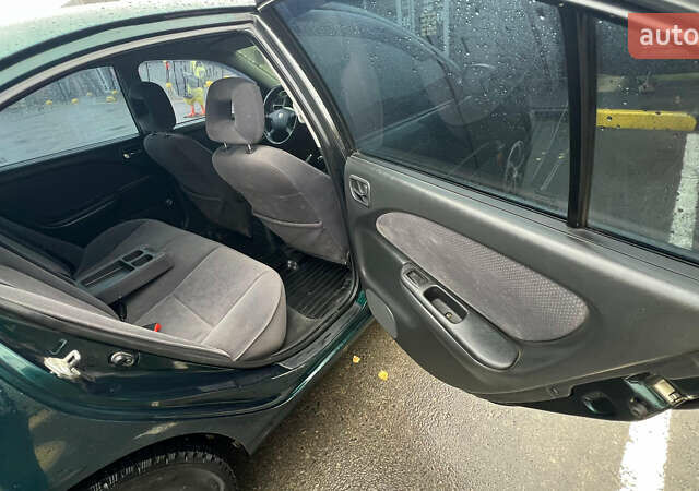 Зеленый Тойота Авенсис, объемом двигателя 2 л и пробегом 306 тыс. км за 4300 $, фото 17 на Automoto.ua