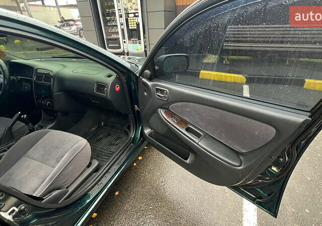 Зеленый Тойота Авенсис, объемом двигателя 2 л и пробегом 306 тыс. км за 4300 $, фото 15 на Automoto.ua