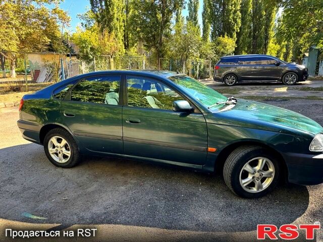 Зеленый Тойота Авенсис, объемом двигателя 2 л и пробегом 285 тыс. км за 3200 $, фото 2 на Automoto.ua
