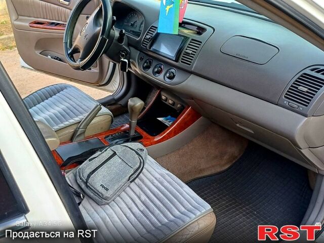 Білий Тойота Камрі, об'ємом двигуна 2.4 л та пробігом 255 тис. км за 5300 $, фото 6 на Automoto.ua