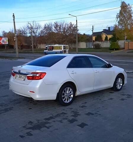 Белый Тойота Камри, объемом двигателя 2.5 л и пробегом 195 тыс. км за 11800 $, фото 4 на Automoto.ua