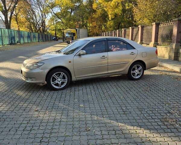 Бежевий Тойота Камрі, об'ємом двигуна 3 л та пробігом 438 тис. км за 5500 $, фото 12 на Automoto.ua