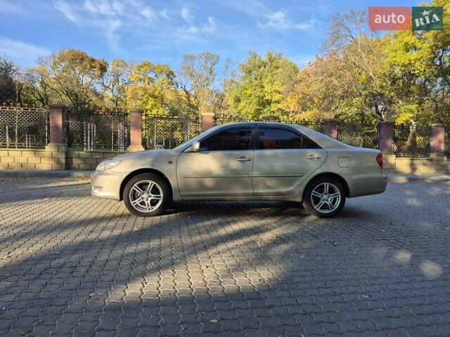 Бежевий Тойота Камрі, об'ємом двигуна 3 л та пробігом 438 тис. км за 5500 $, фото 26 на Automoto.ua