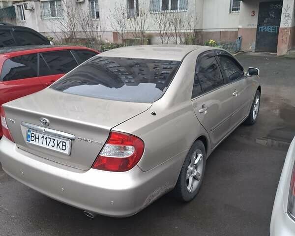 Бежевый Тойота Камри, объемом двигателя 2.4 л и пробегом 250 тыс. км за 8900 $, фото 1 на Automoto.ua