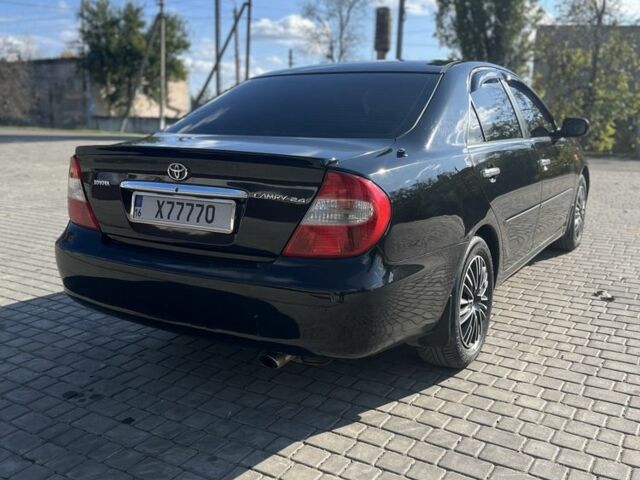 Черный Тойота Камри, объемом двигателя 2.4 л и пробегом 350 тыс. км за 6800 $, фото 6 на Automoto.ua