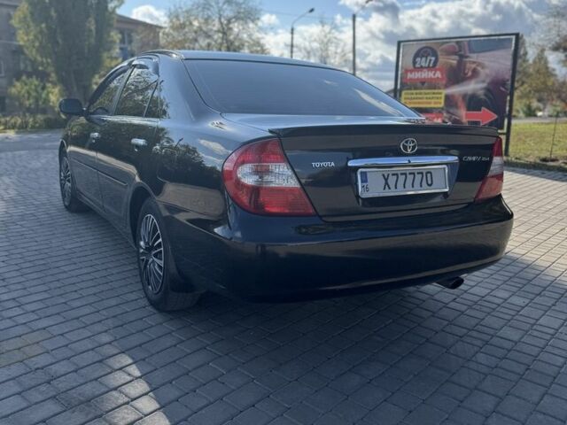 Черный Тойота Камри, объемом двигателя 2.4 л и пробегом 350 тыс. км за 6800 $, фото 7 на Automoto.ua