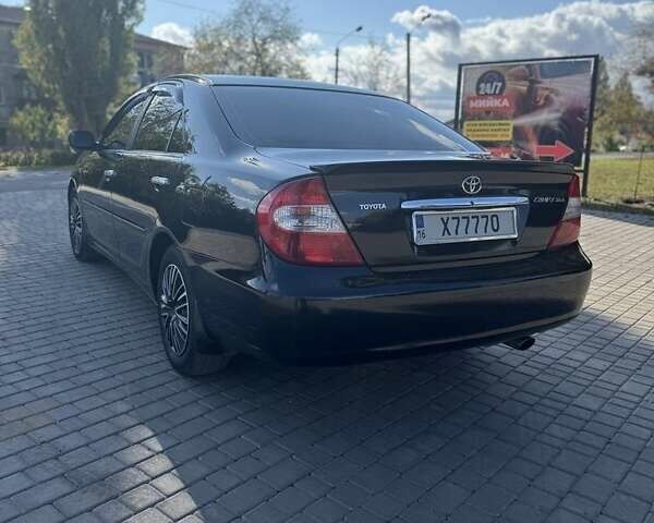 Черный Тойота Камри, объемом двигателя 2.4 л и пробегом 350 тыс. км за 6800 $, фото 6 на Automoto.ua