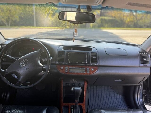 Черный Тойота Камри, объемом двигателя 2.4 л и пробегом 350 тыс. км за 6800 $, фото 4 на Automoto.ua