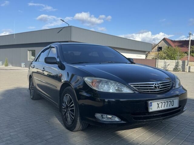 Черный Тойота Камри, объемом двигателя 2.4 л и пробегом 350 тыс. км за 6800 $, фото 2 на Automoto.ua