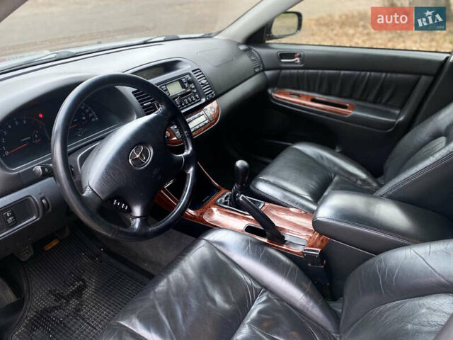 Чорний Тойота Камрі, об'ємом двигуна 2.4 л та пробігом 201 тис. км за 6999 $, фото 16 на Automoto.ua