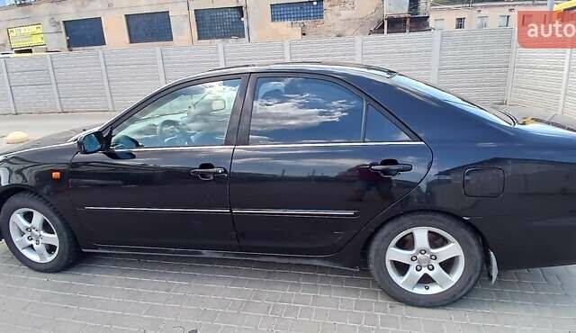 Чорний Тойота Камрі, об'ємом двигуна 2.4 л та пробігом 300 тис. км за 5200 $, фото 3 на Automoto.ua