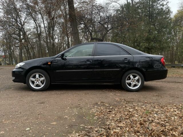 Чорний Тойота Камрі, об'ємом двигуна 2.4 л та пробігом 201 тис. км за 6999 $, фото 12 на Automoto.ua