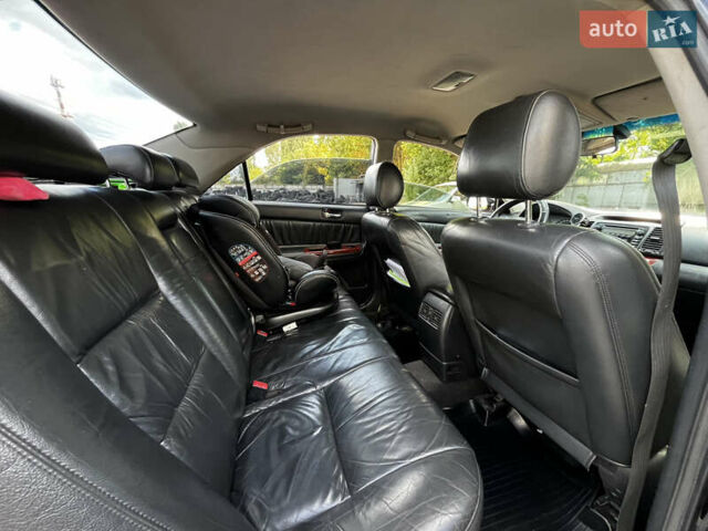 Черный Тойота Камри, объемом двигателя 3 л и пробегом 320 тыс. км за 5100 $, фото 5 на Automoto.ua