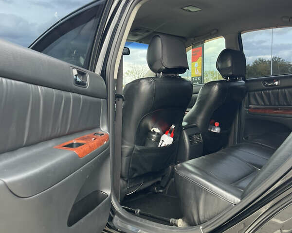 Черный Тойота Камри, объемом двигателя 2.4 л и пробегом 225 тыс. км за 7500 $, фото 14 на Automoto.ua