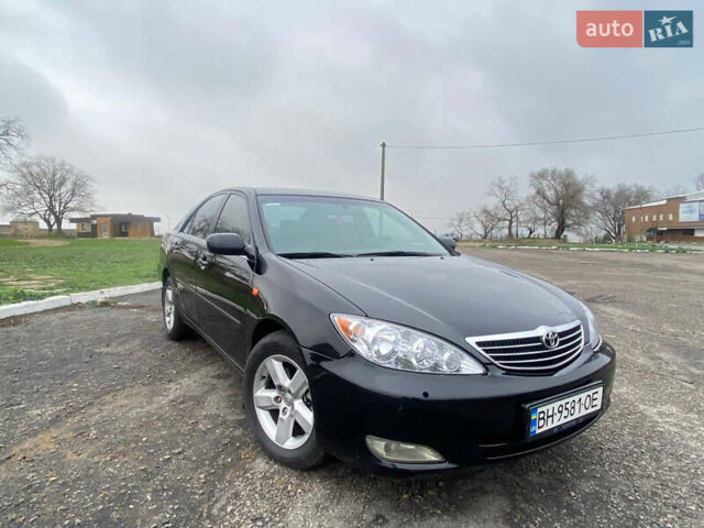 Черный Тойота Камри, объемом двигателя 3 л и пробегом 325 тыс. км за 6000 $, фото 4 на Automoto.ua