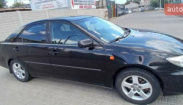 Чорний Тойота Камрі, об'ємом двигуна 2.4 л та пробігом 300 тис. км за 5200 $, фото 2 на Automoto.ua