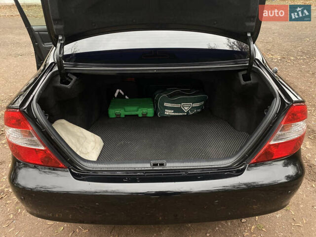 Чорний Тойота Камрі, об'ємом двигуна 2.4 л та пробігом 201 тис. км за 6999 $, фото 20 на Automoto.ua