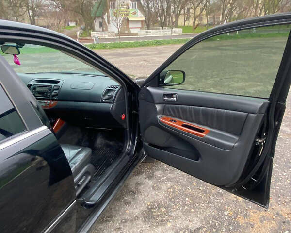 Черный Тойота Камри, объемом двигателя 3 л и пробегом 325 тыс. км за 6000 $, фото 10 на Automoto.ua