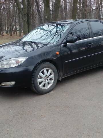 Черный Тойота Камри, объемом двигателя 2.4 л и пробегом 298 тыс. км за 5200 $, фото 1 на Automoto.ua