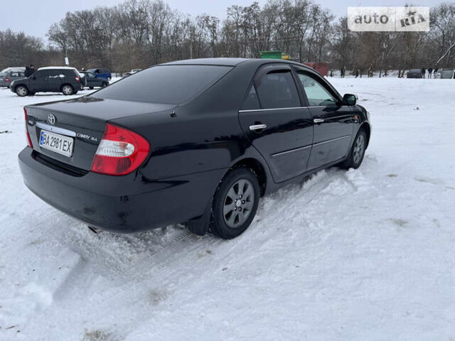 Черный Тойота Камри, объемом двигателя 2.36 л и пробегом 489 тыс. км за 5400 $, фото 4 на Automoto.ua