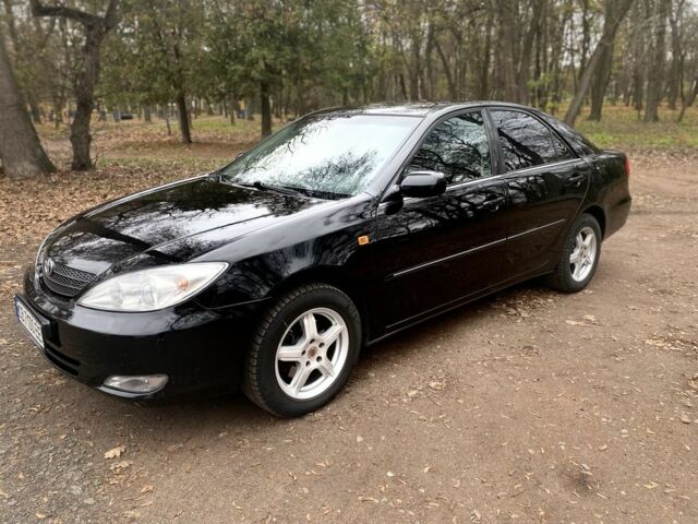 Чорний Тойота Камрі, об'ємом двигуна 2.4 л та пробігом 201 тис. км за 6999 $, фото 13 на Automoto.ua