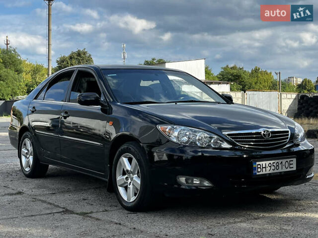 Черный Тойота Камри, объемом двигателя 3 л и пробегом 320 тыс. км за 5100 $, фото 1 на Automoto.ua