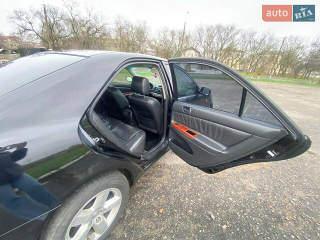 Черный Тойота Камри, объемом двигателя 3 л и пробегом 325 тыс. км за 6000 $, фото 11 на Automoto.ua