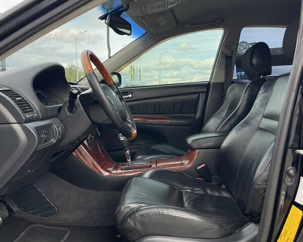 Черный Тойота Камри, объемом двигателя 2.4 л и пробегом 225 тыс. км за 7500 $, фото 10 на Automoto.ua
