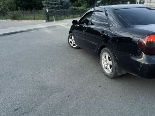 Чорний Тойота Камрі, об'ємом двигуна 3 л та пробігом 330 тис. км за 4400 $, фото 5 на Automoto.ua