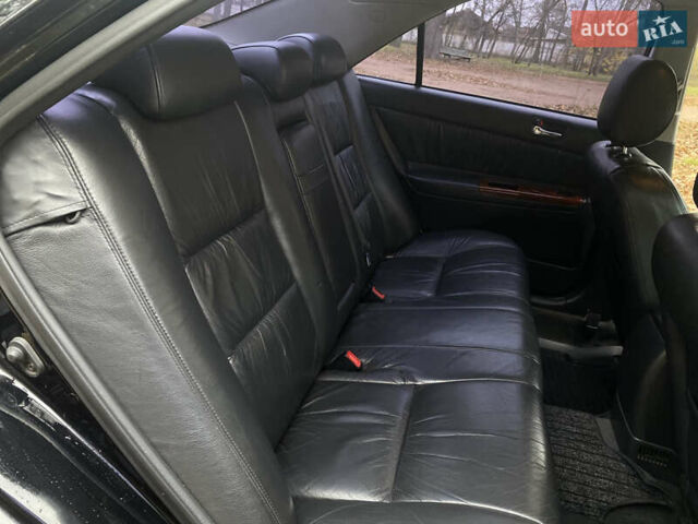 Чорний Тойота Камрі, об'ємом двигуна 2.4 л та пробігом 201 тис. км за 6999 $, фото 22 на Automoto.ua