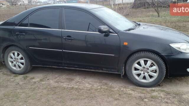 Черный Тойота Камри, объемом двигателя 2.4 л и пробегом 298 тыс. км за 5200 $, фото 12 на Automoto.ua