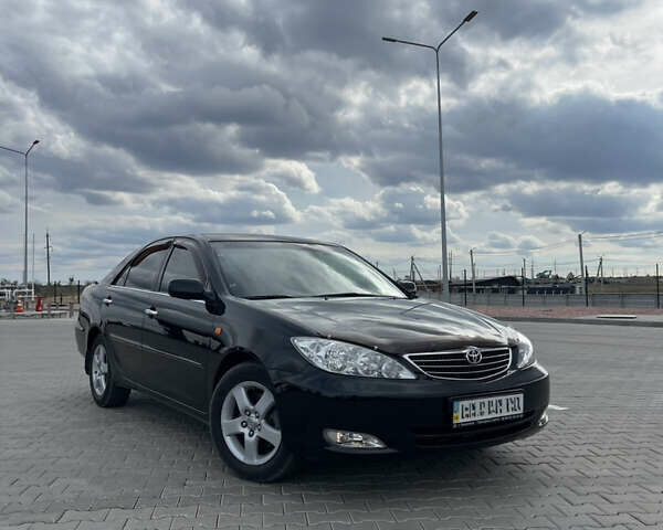 Черный Тойота Камри, объемом двигателя 2.4 л и пробегом 225 тыс. км за 7500 $, фото 3 на Automoto.ua