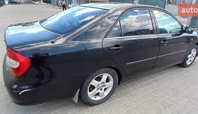 Чорний Тойота Камрі, об'ємом двигуна 2.4 л та пробігом 300 тис. км за 5200 $, фото 4 на Automoto.ua