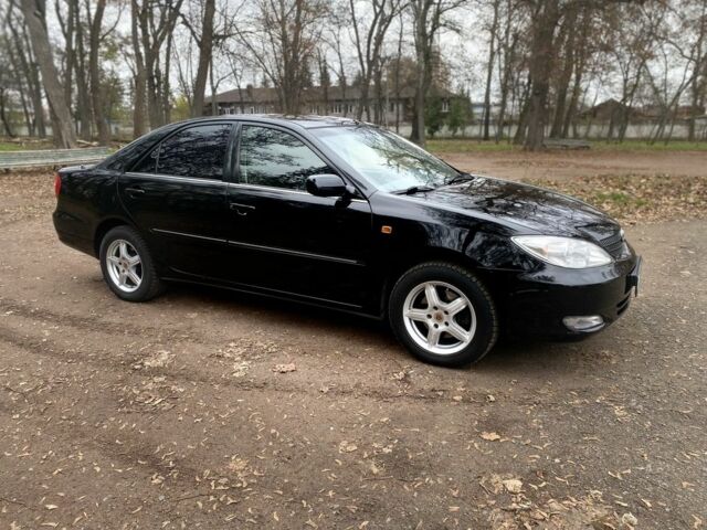 Чорний Тойота Камрі, об'ємом двигуна 2.4 л та пробігом 201 тис. км за 6999 $, фото 4 на Automoto.ua