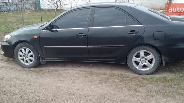 Черный Тойота Камри, объемом двигателя 2.4 л и пробегом 298 тыс. км за 5200 $, фото 13 на Automoto.ua