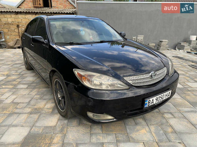 Черный Тойота Камри, объемом двигателя 2.37 л и пробегом 170 тыс. км за 4300 $, фото 1 на Automoto.ua