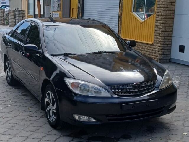 Черный Тойота Камри, объемом двигателя 2.4 л и пробегом 307 тыс. км за 4500 $, фото 6 на Automoto.ua