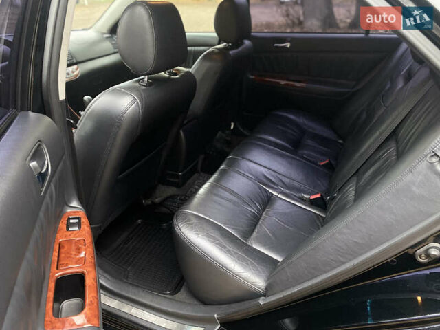 Чорний Тойота Камрі, об'ємом двигуна 2.4 л та пробігом 201 тис. км за 6999 $, фото 19 на Automoto.ua