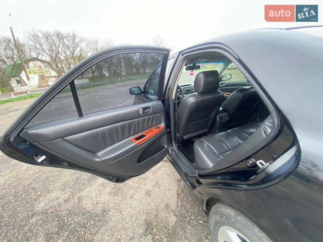 Черный Тойота Камри, объемом двигателя 3 л и пробегом 325 тыс. км за 6000 $, фото 12 на Automoto.ua