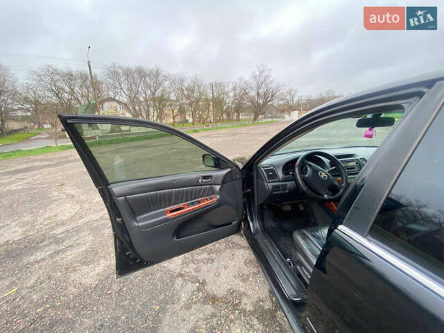 Черный Тойота Камри, объемом двигателя 3 л и пробегом 325 тыс. км за 6000 $, фото 9 на Automoto.ua