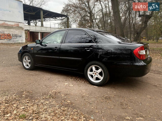 Чорний Тойота Камрі, об'ємом двигуна 2.4 л та пробігом 201 тис. км за 6999 $, фото 12 на Automoto.ua