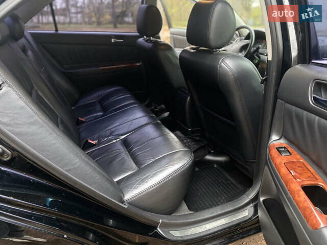 Чорний Тойота Камрі, об'ємом двигуна 2.4 л та пробігом 201 тис. км за 6999 $, фото 21 на Automoto.ua