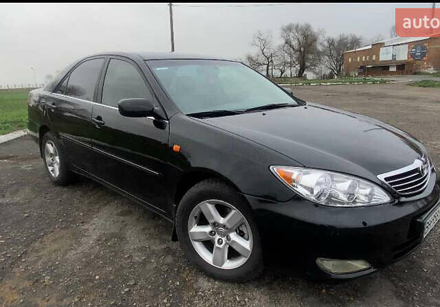 Черный Тойота Камри, объемом двигателя 3 л и пробегом 325 тыс. км за 6000 $, фото 1 на Automoto.ua