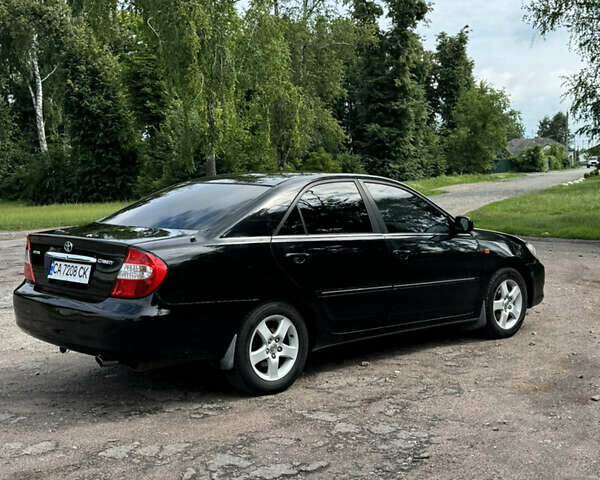 Черный Тойота Камри, объемом двигателя 2.4 л и пробегом 280 тыс. км за 4800 $, фото 3 на Automoto.ua